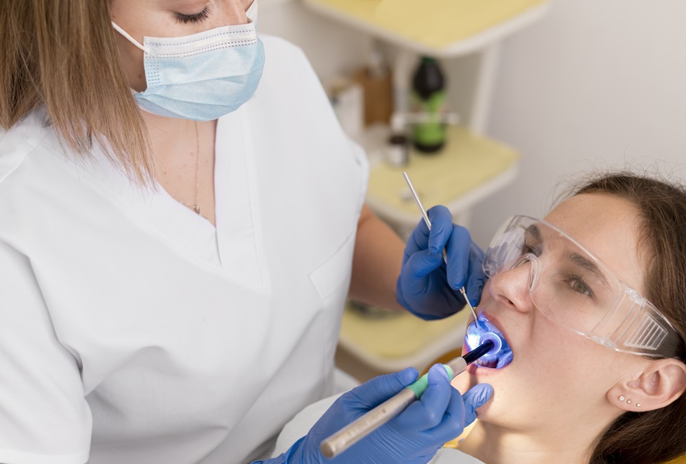 dentist performing deep dental cleaning