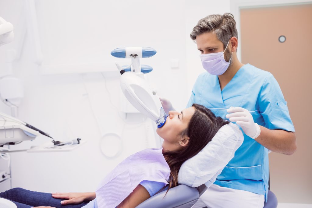Patient receiving a dental treatment at clinic